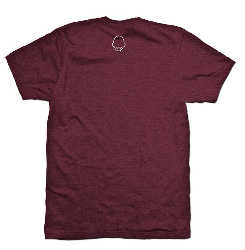 Maroon t-shirt with a bald head logo on the back.